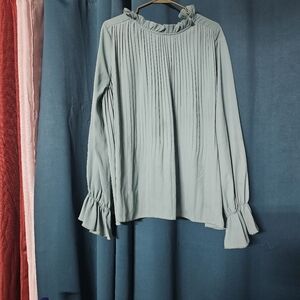 Ruffle Trim pleated Blue blouse.